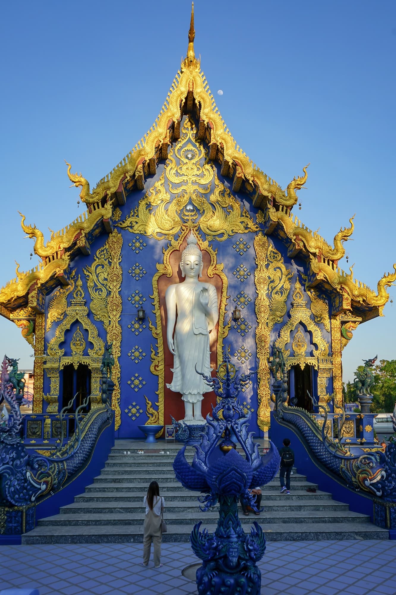 Gold and blue facade of Wat Rong Suea Ten in Chiang Rai