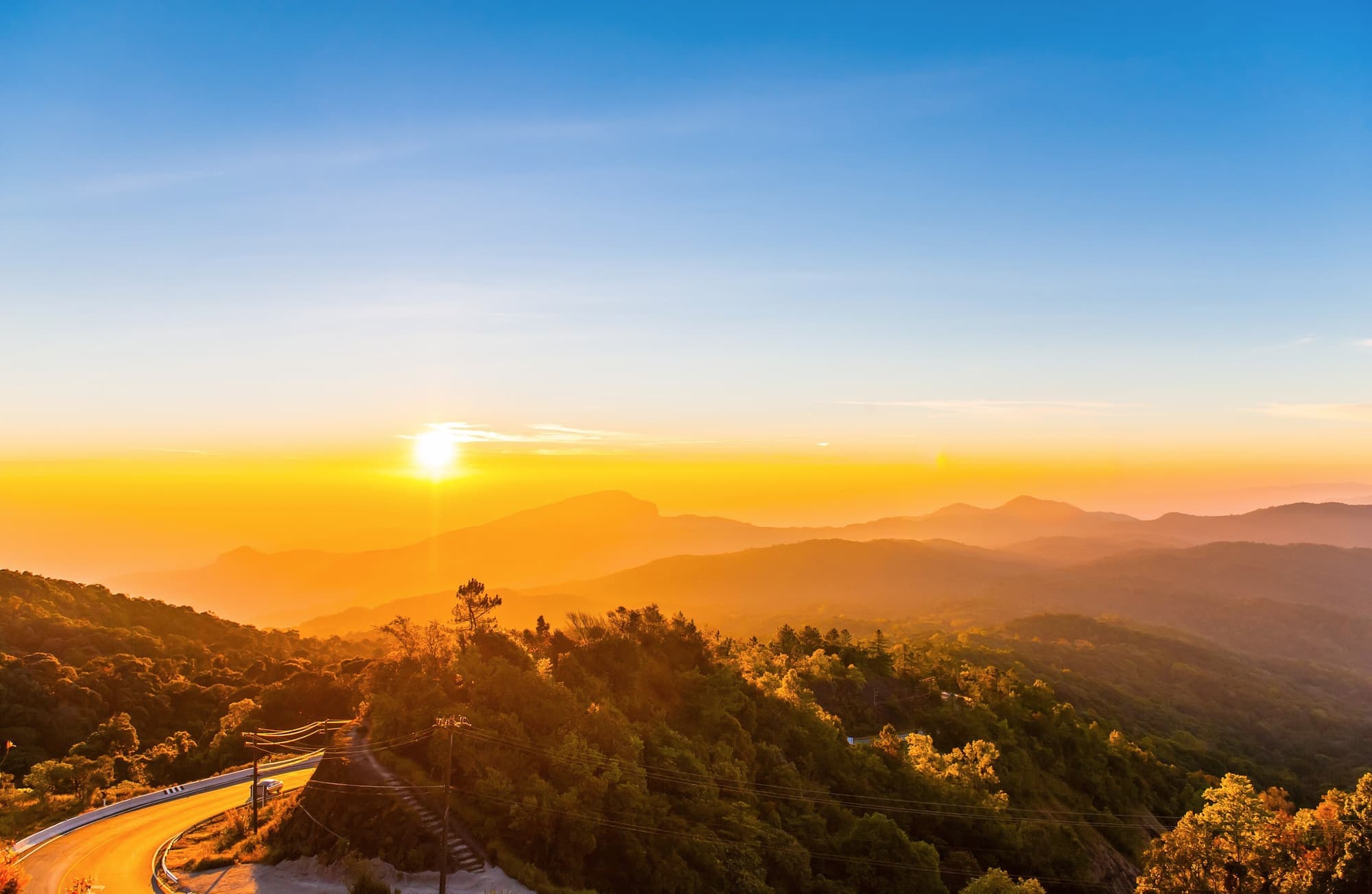 Sunrise over layered mountain ridges seen from Doi Inthanon