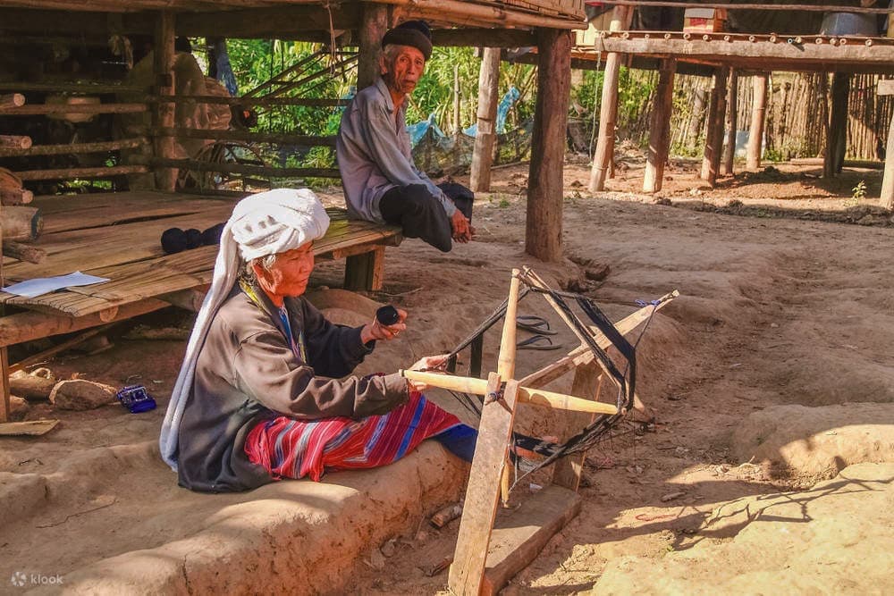 A Karen woman weaving cloth in a hill-tribe village on Doi Inthanon